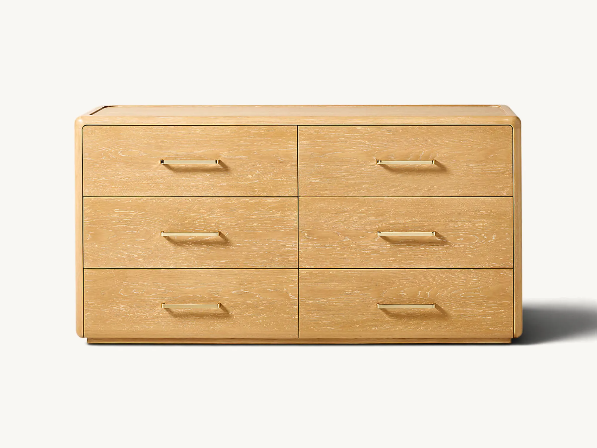 Natural light wood six-drawer storage dresser with rounded outer edges, subtle wood grain texture, and slim brass metal handles