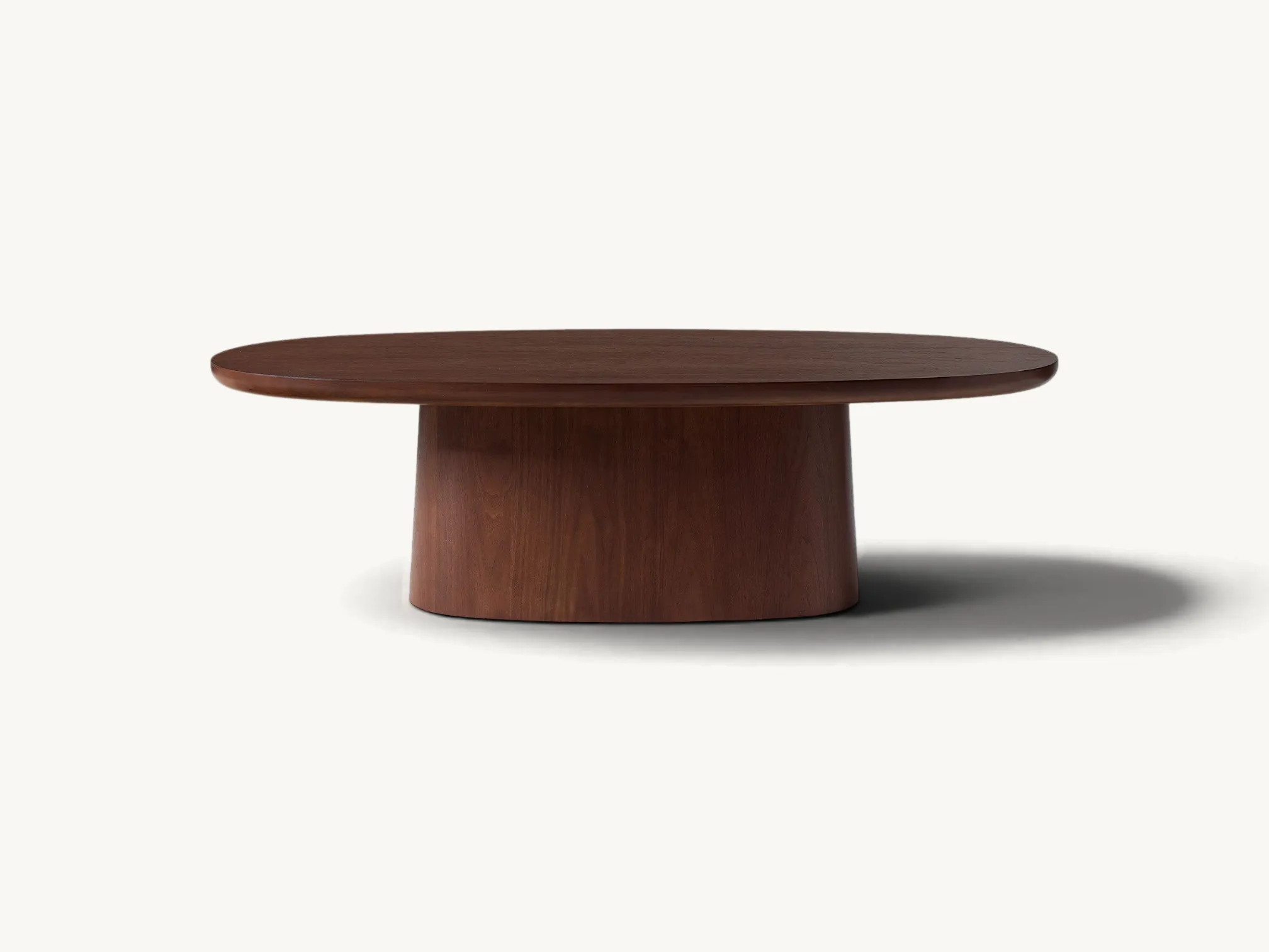 Oval wooden coffee table with a solid pedestal base in a rich warm brown wood finish