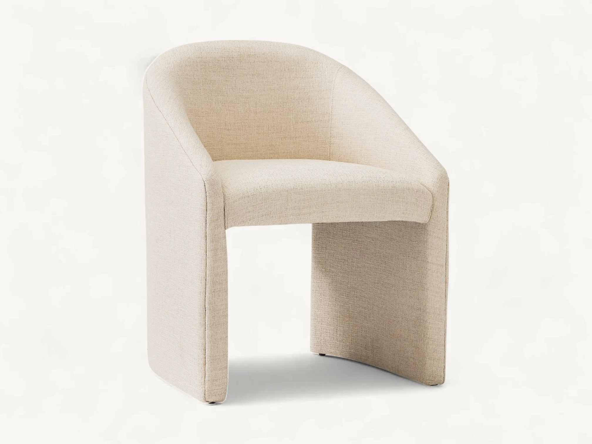 Modern fully upholstered dining chair in cream fabric with a wrap-around backrest and teak wood internal frame.