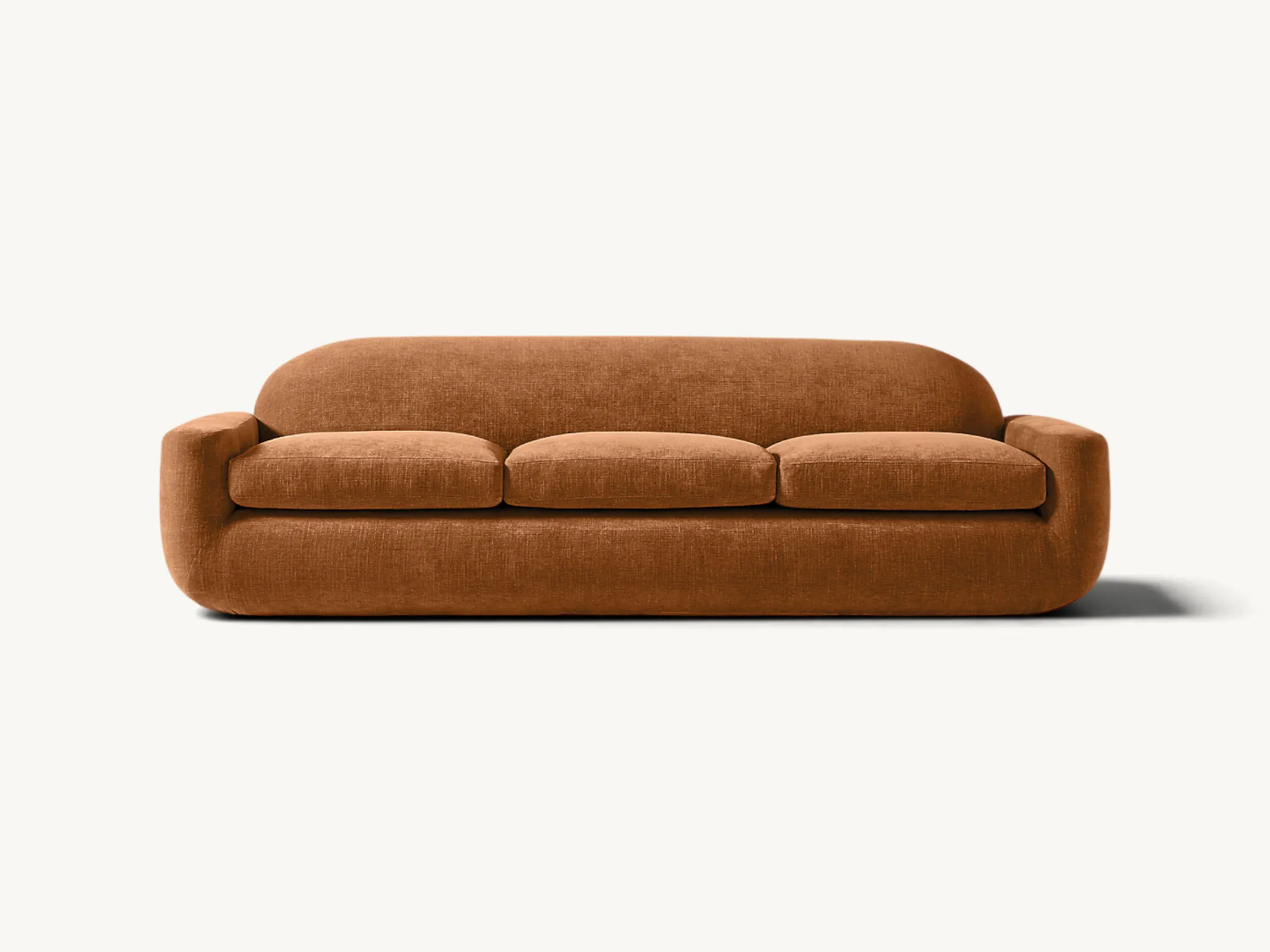 Three-seater upholstered sofa featuring a low-profile curved organic frame in warm terracotta brown fabric