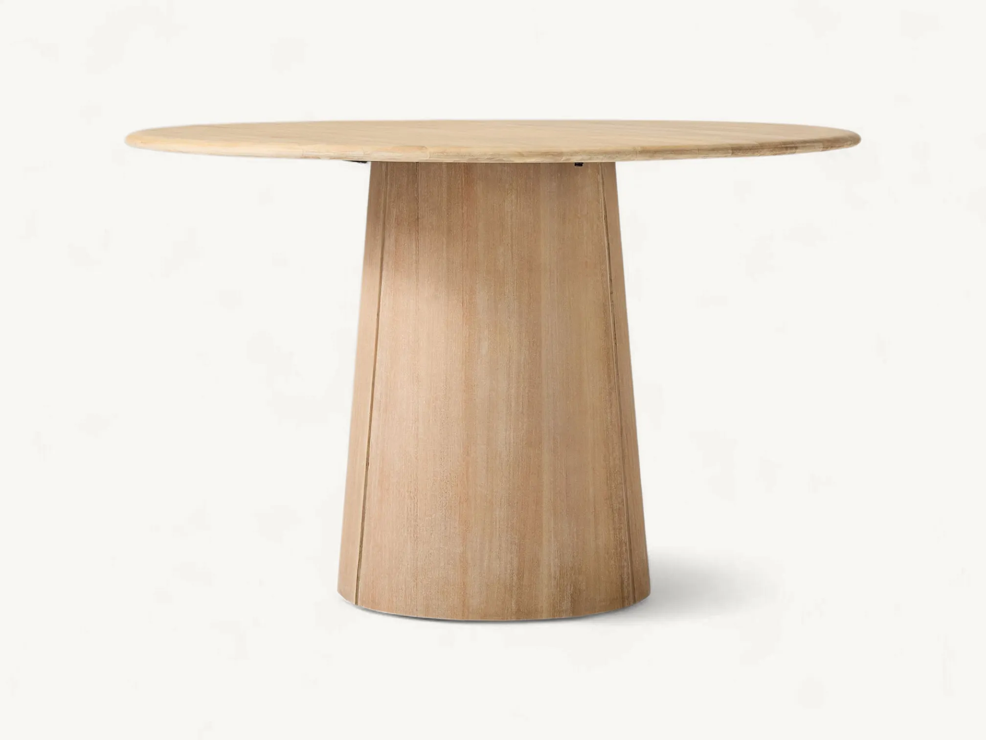 Japandi style round teak dining table with a solid tapered pedestal base.