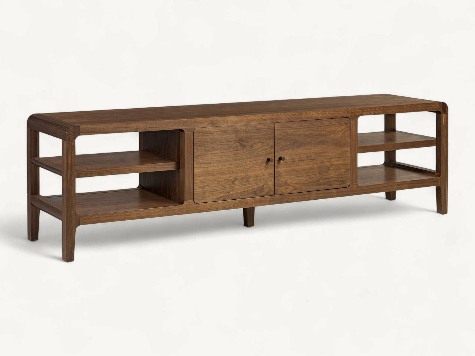 Mid-century solid teak media console with rounded frame corners, open side shelves, and a central cabinet with minimalist dark knobs.