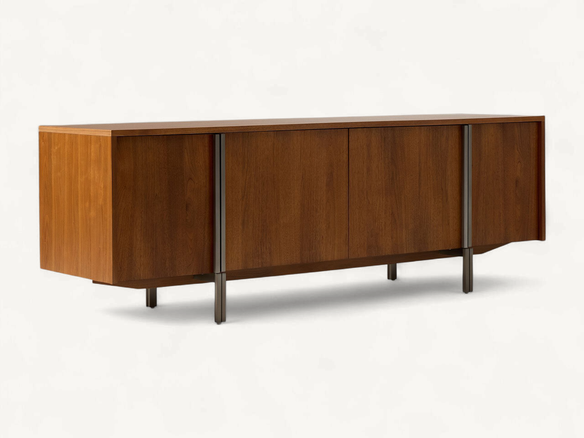 Contemporary solid teak media sideboard featuring four seamless doors and slim vertical metal leg accents.