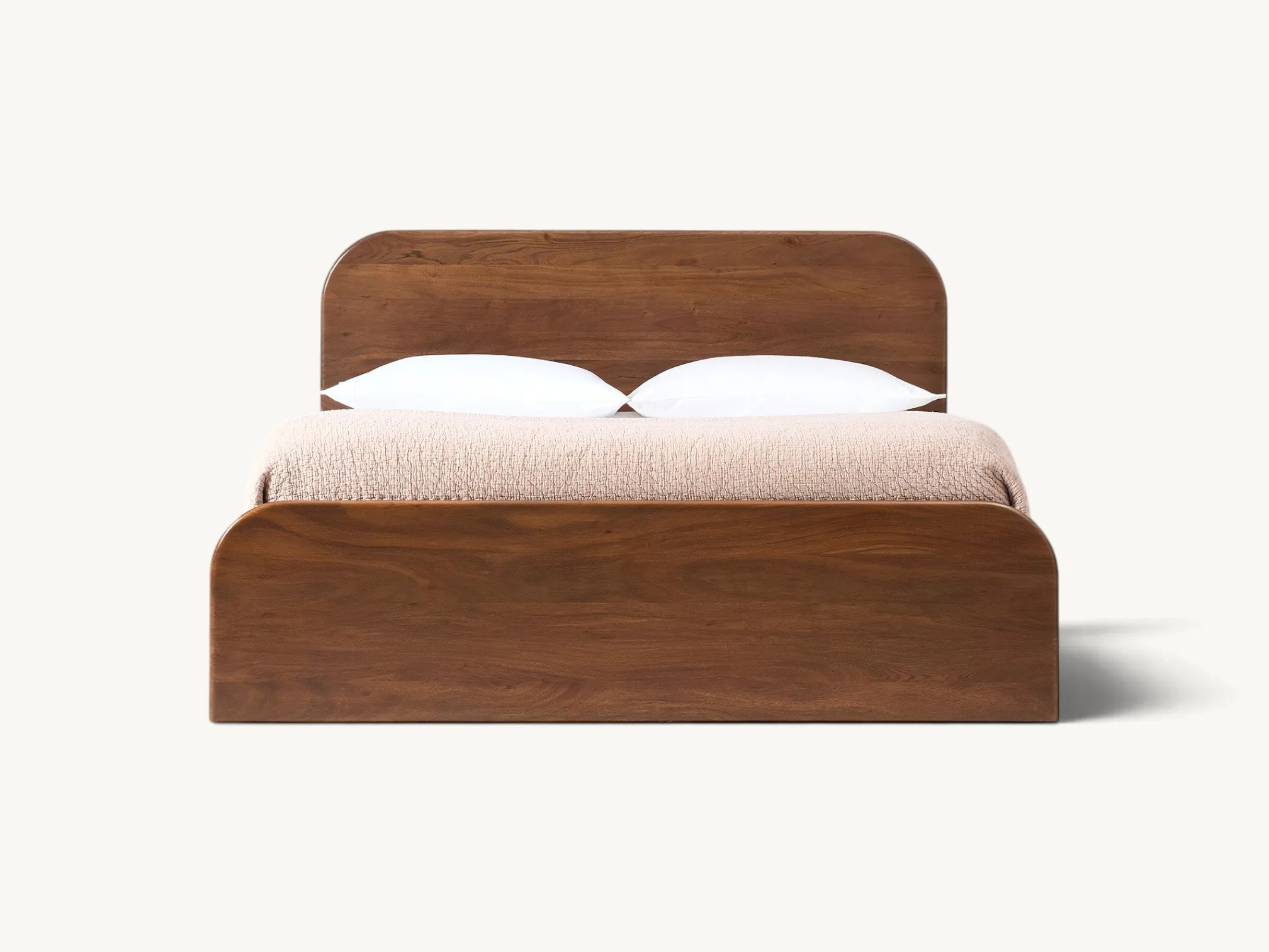 Solid wooden platform bed frame with rounded headboard and footboard in rich warm wood finish