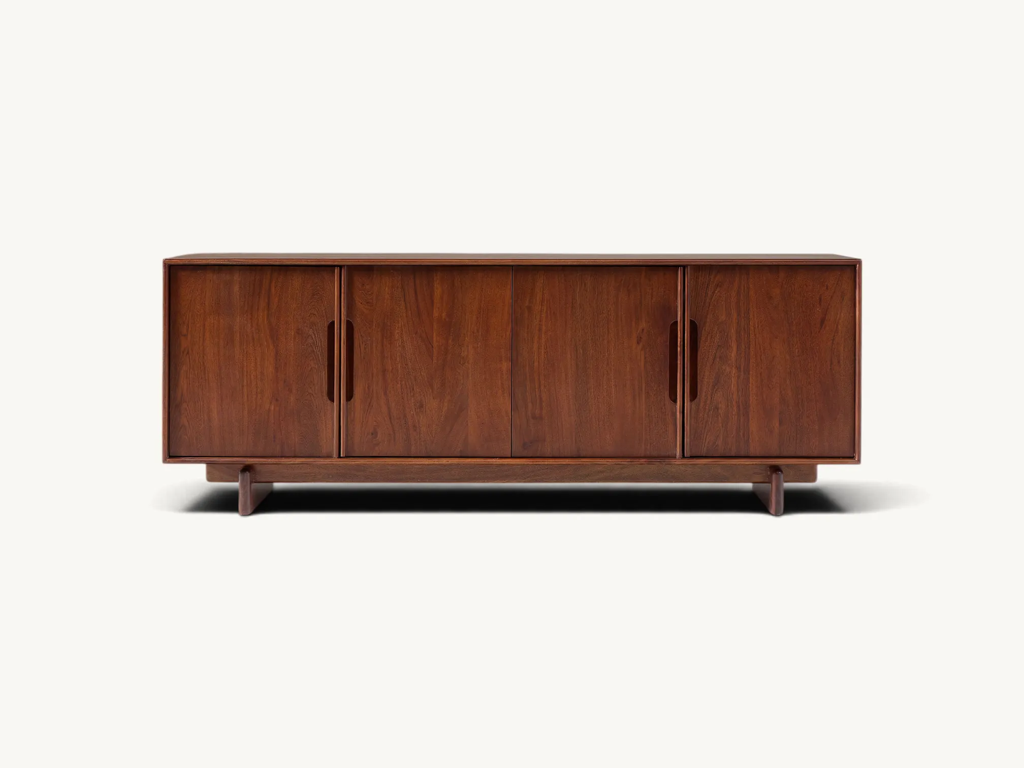 Four door wooden media console sideboard with integrated vertical handles and plinth base in rich warm brown finish