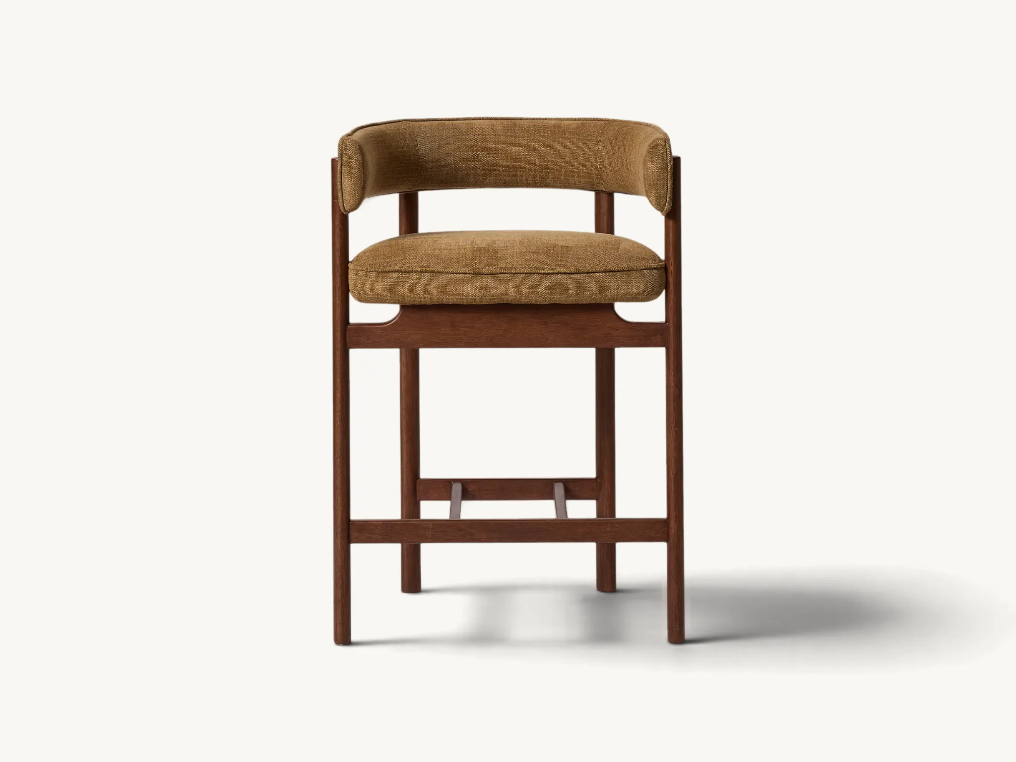 Upholstered wooden counter stool with curved barrel backrest and footrest in warm brown textured fabric