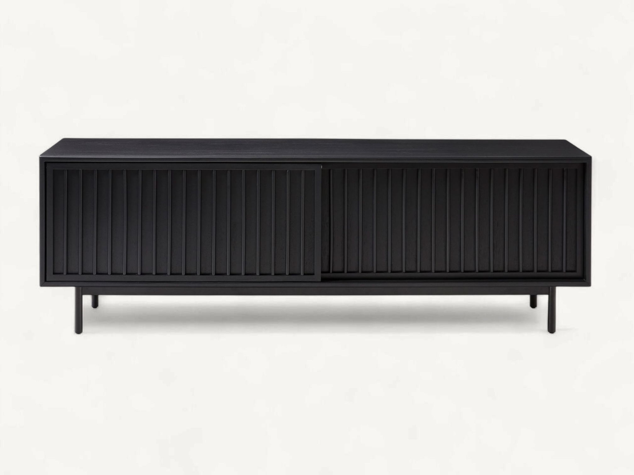 Mid-century teak wood TV console with vertical slatted sliding doors and slim black metal legs in a warm natural finish.