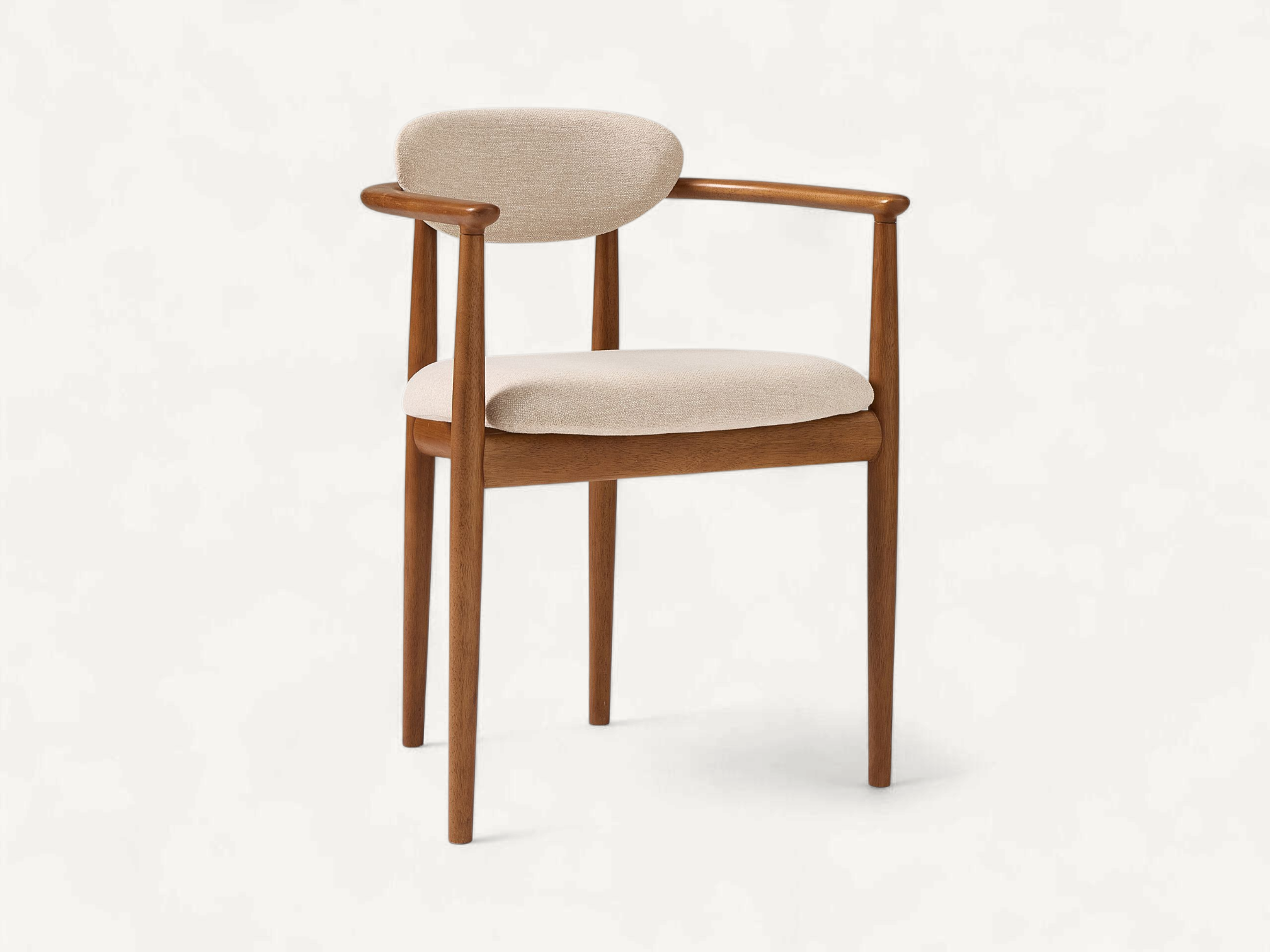 Scandinavian style teak wood dining chair with curved backrest and cream upholstery.