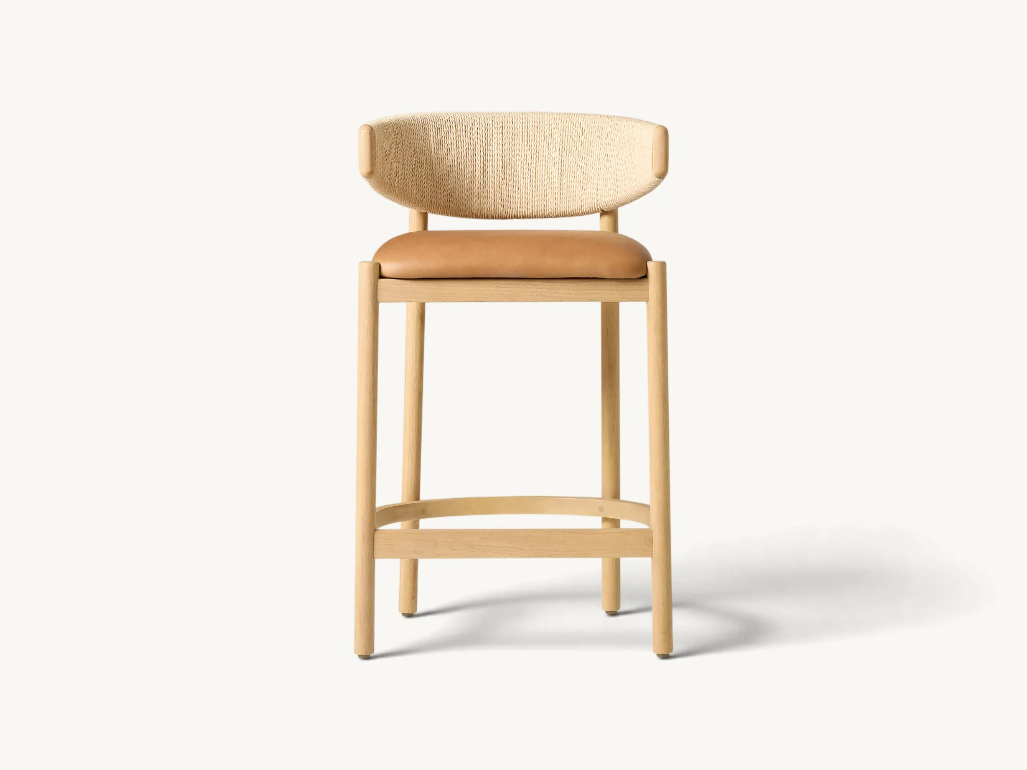 Wooden counter stool with woven cord curved backrest and tan leather seat cushion in natural light oak finish
