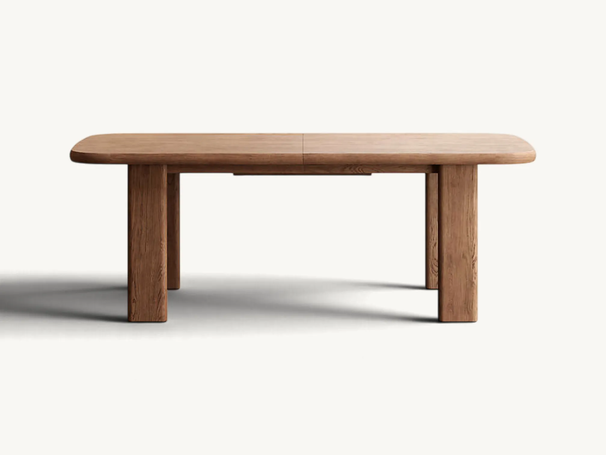 Extendable solid wood dining table with rounded corners and sturdy thick legs