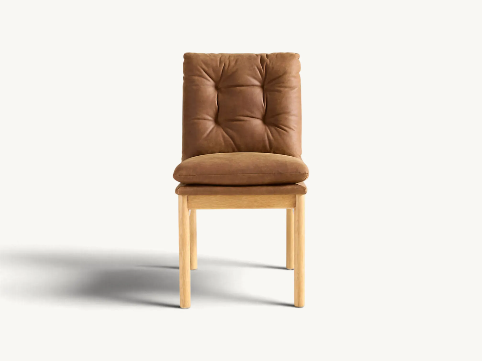 Light oak wooden dining chair with tufted brown leather seat and back cushion with sling support