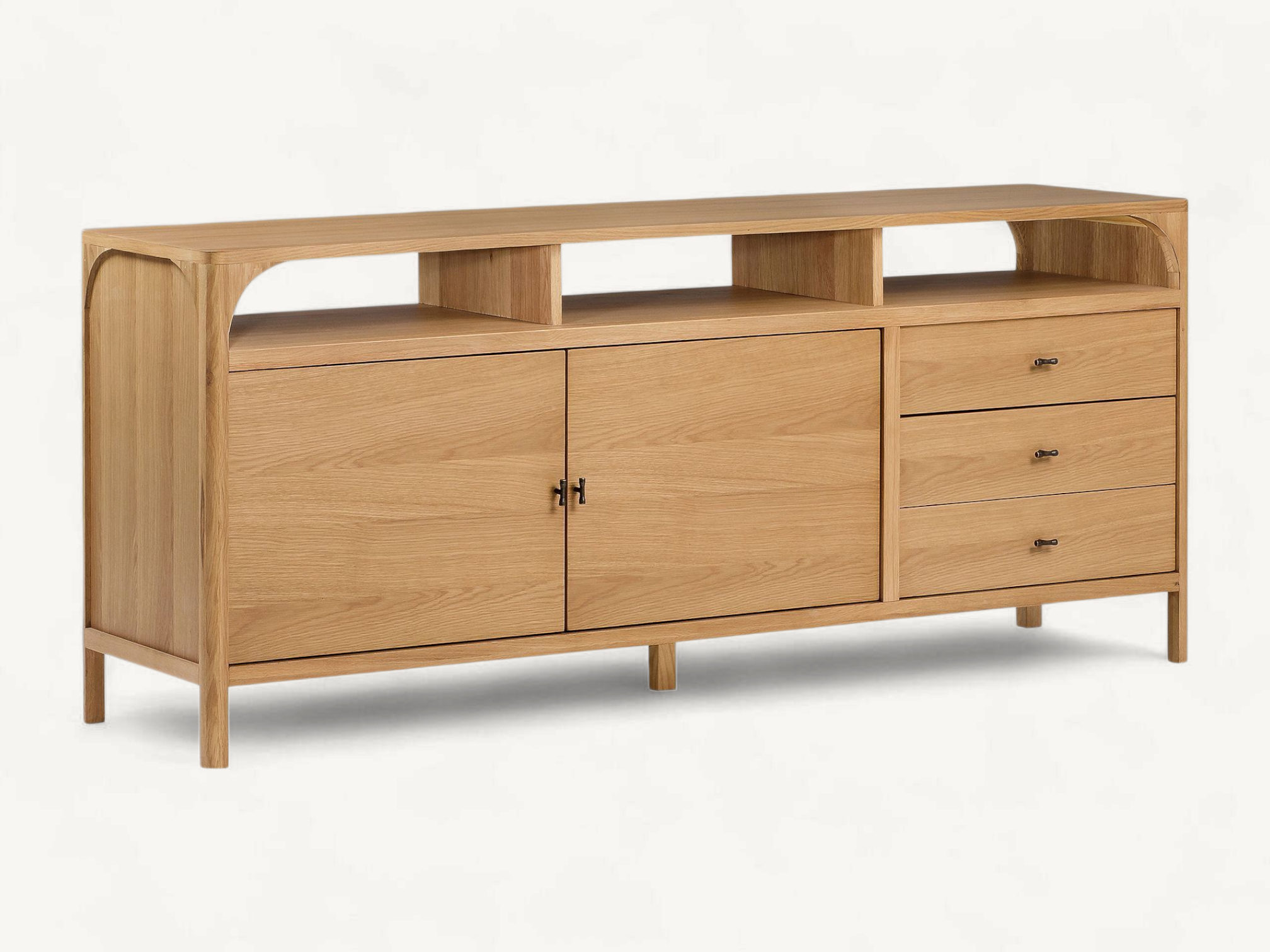 Minimalist light-toned teak wood media console with open top shelving, two cabinet doors, and three side drawers on slim legs.