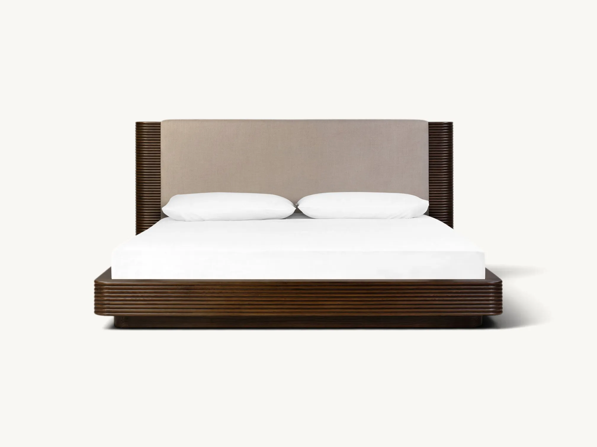 Wooden platform bed frame with neutral upholstered headboard and reeded side accents in dark brown wood finish