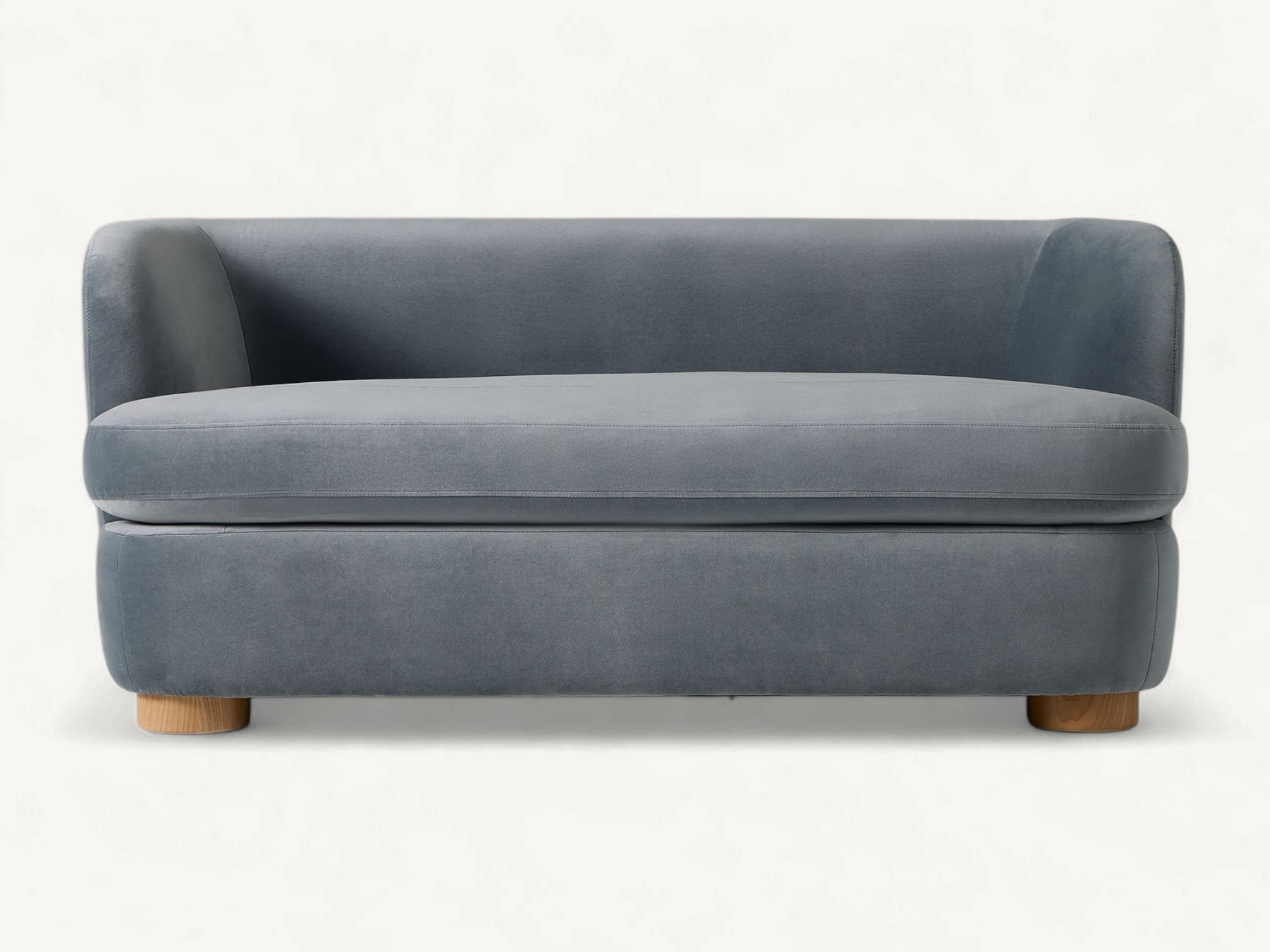 Contemporary 2-seater sofa in dusty blue velvet with rounded teak wood legs, modern upholstered loveseat with curved backrest for stylish living room.