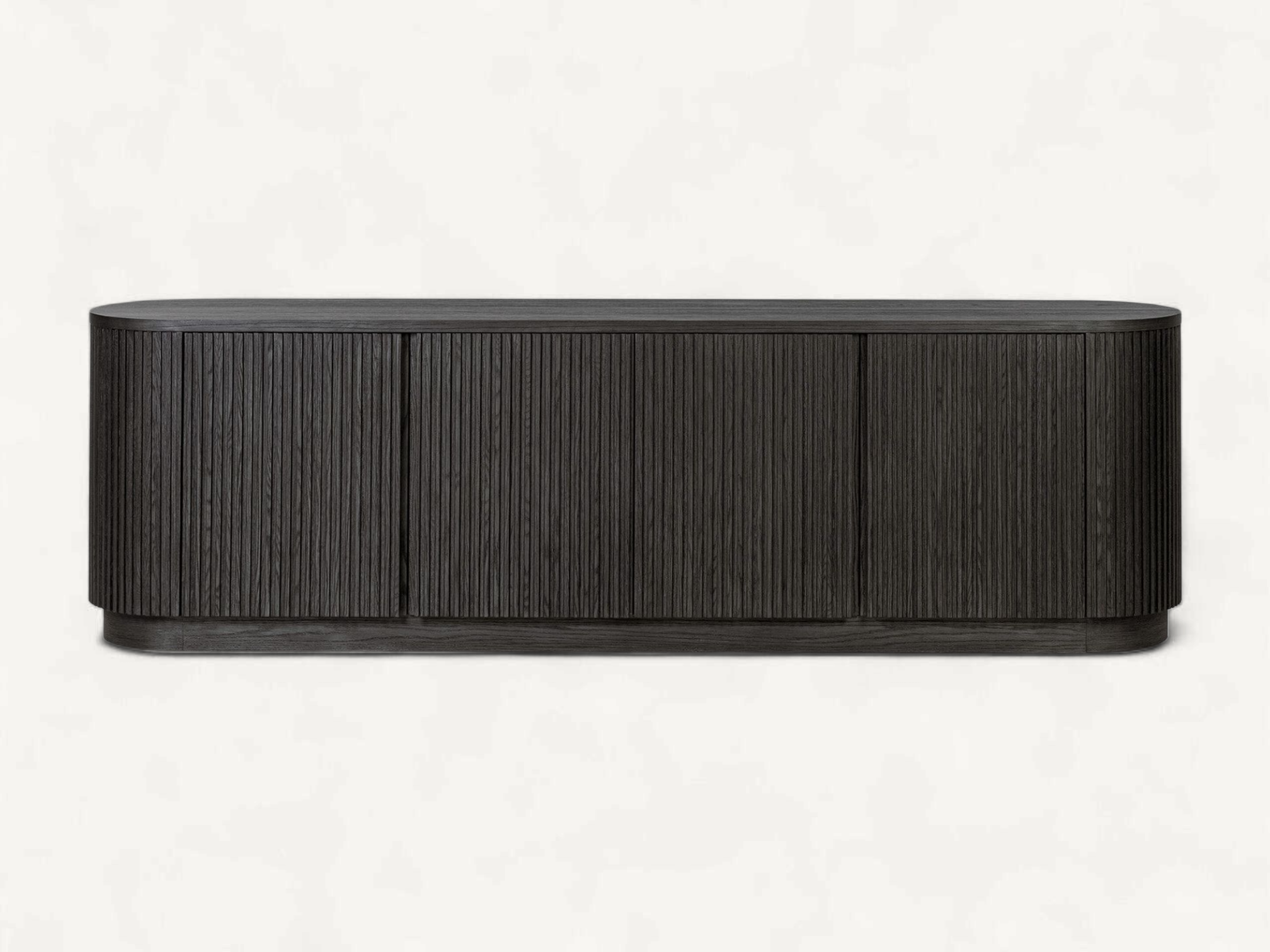 Modern charcoal black teak wood media console with rounded ends and vertical fluted tambour doors on a recessed plinth base.