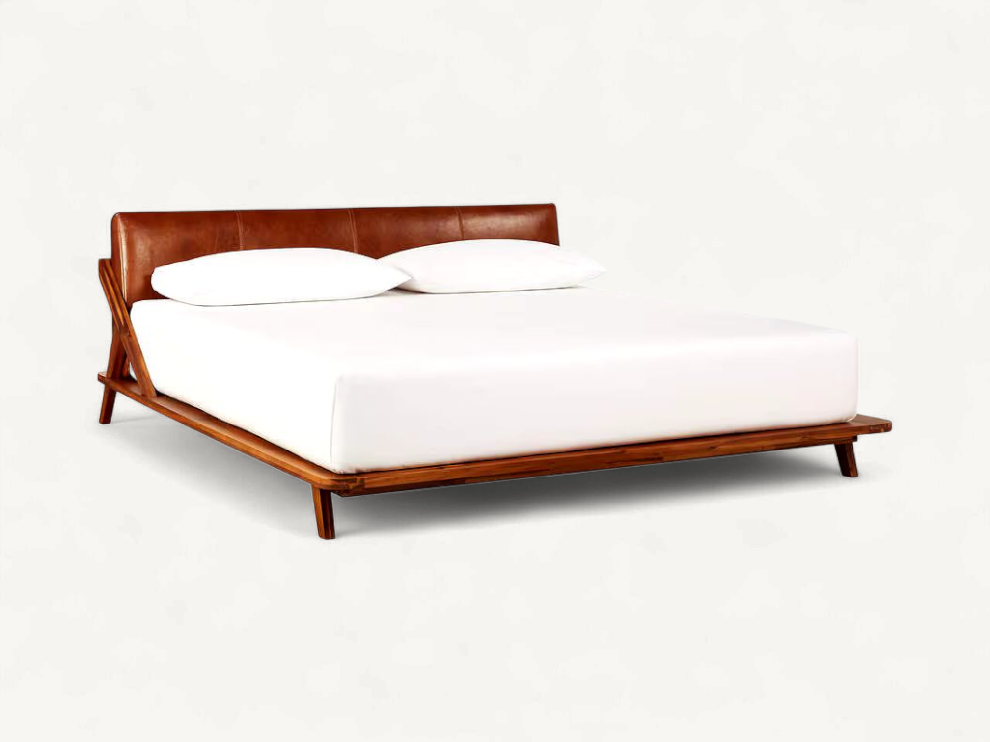 Mid-century modern teak wood bed frame with brown leather headboard and tapered legs.