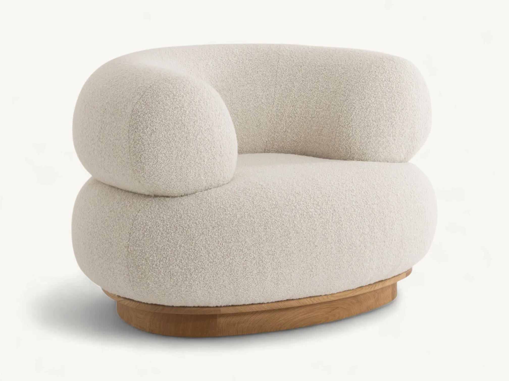 Sculptural cream bouclé armchair with a rounded, tiered silhouette and a low-profile teak wood base.