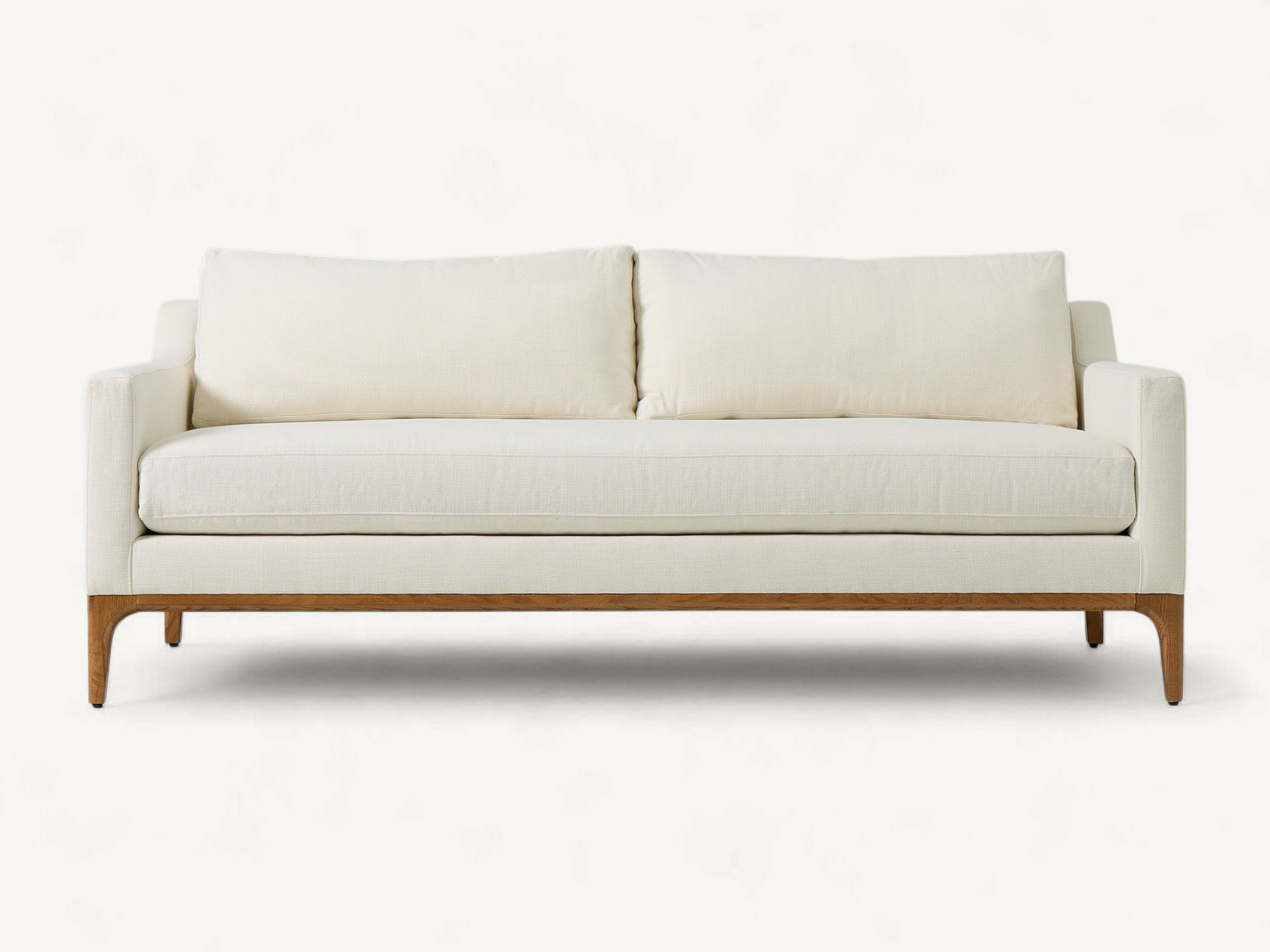 Mid-century modern sofa with natural teak wood base, tapered legs, and off-white upholstery.