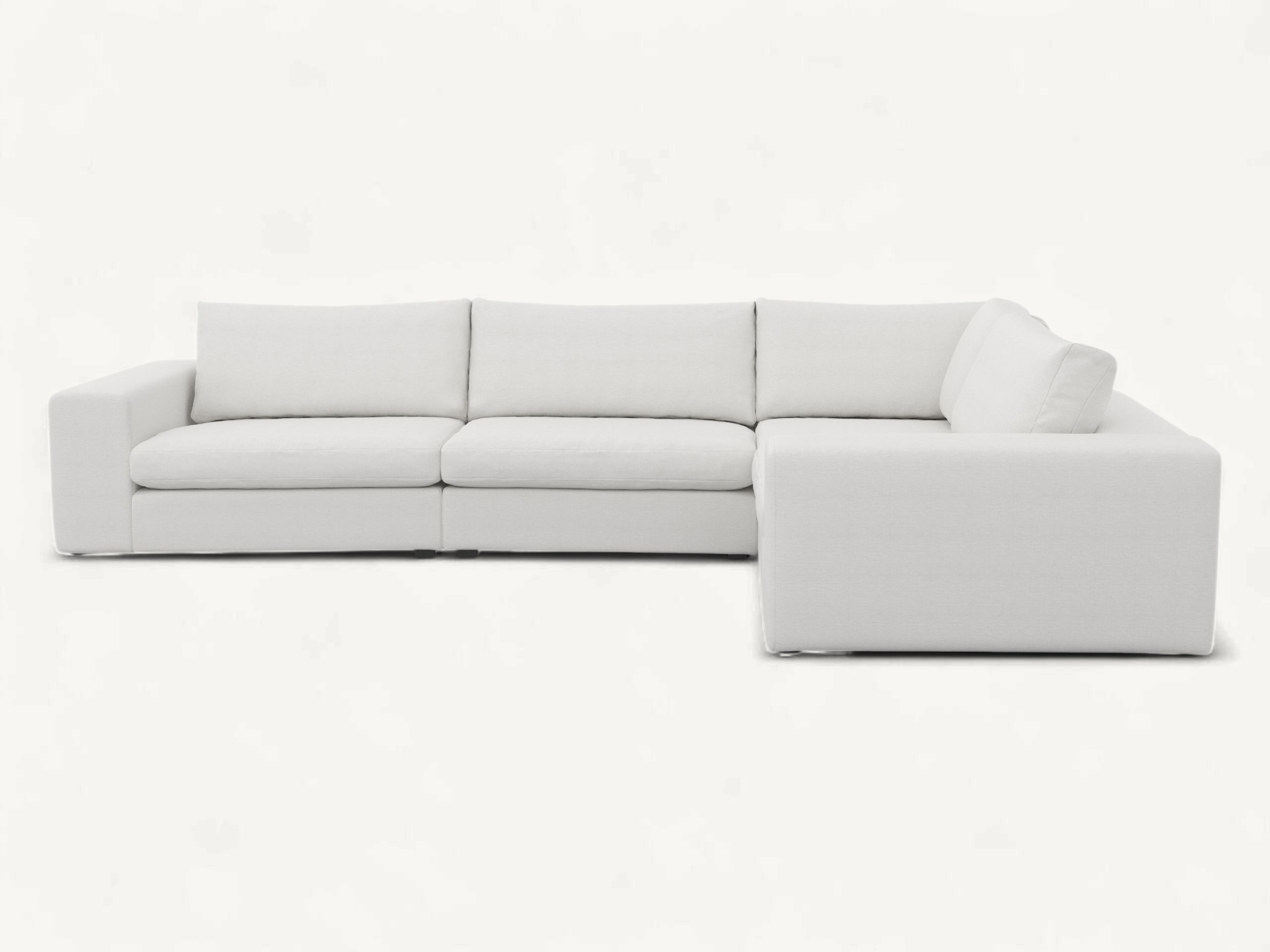 Large modern L-shaped modular sectional sofa in white fabric with a solid teak wood internal structure.
