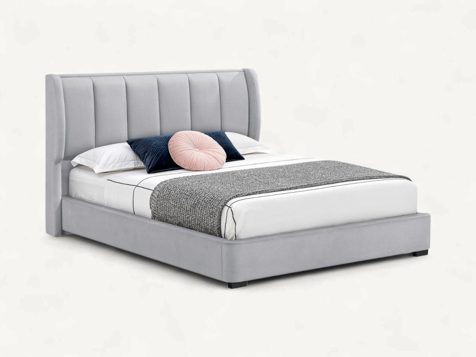 Modern transitional upholstered bed frame with vertical channel tufted wingback headboard and internal teak wood structure.