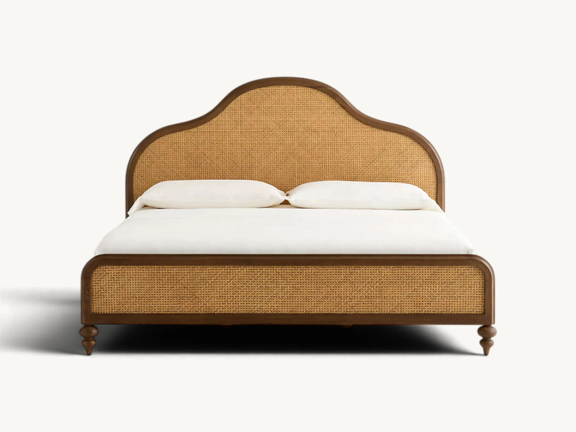 Solid wood bed frame with arched cane headboard, woven rattan footboard, and turned wooden feet