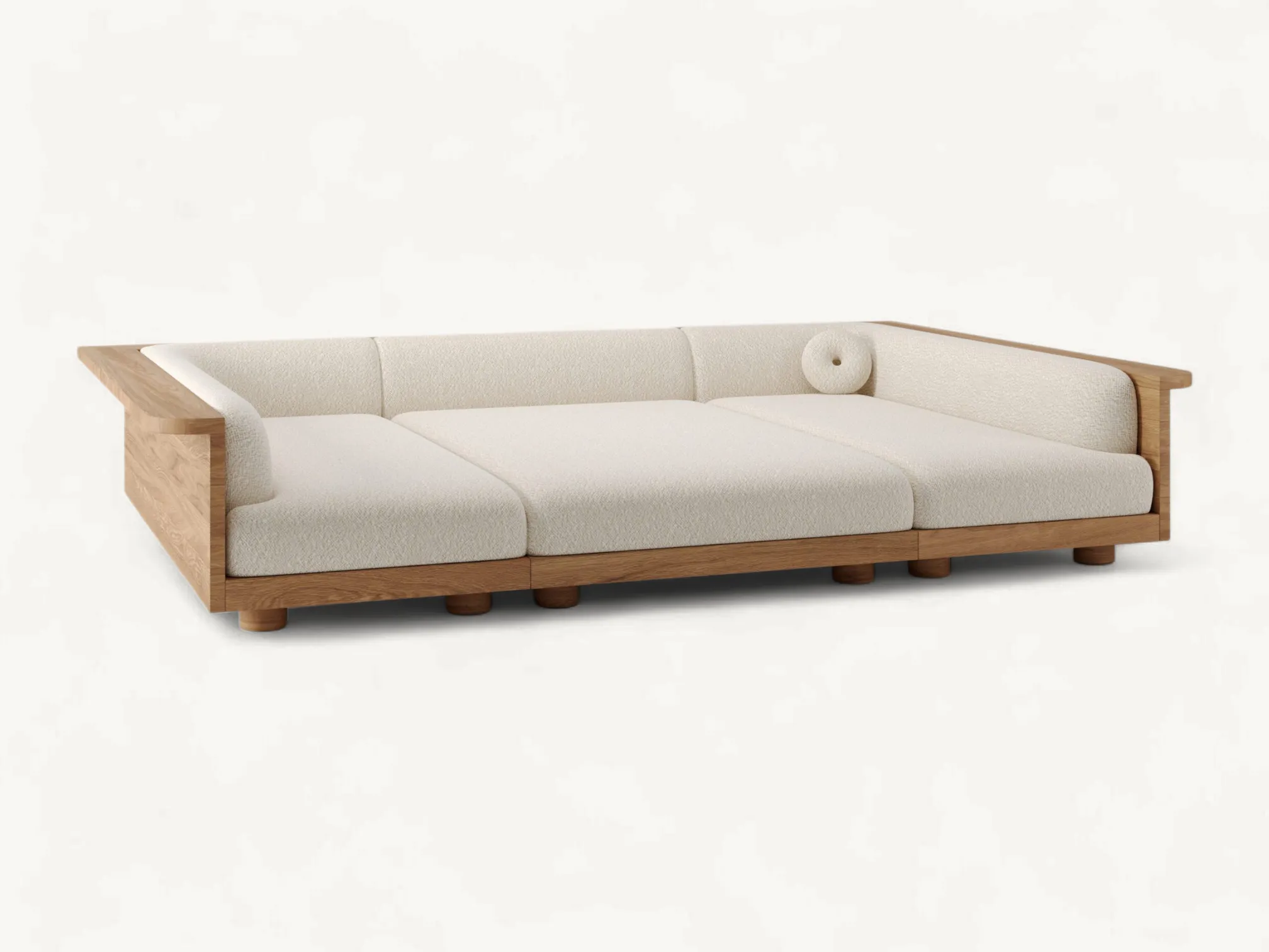 Low-profile Japandi style sofa featuring a solid teak wood frame with natural grain and soft white bouclé fabric cushions.