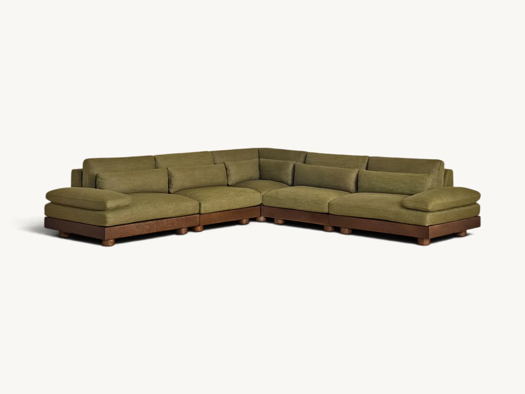 Modular sectional corner sofa with solid wood plinth base and olive green fabric cushions