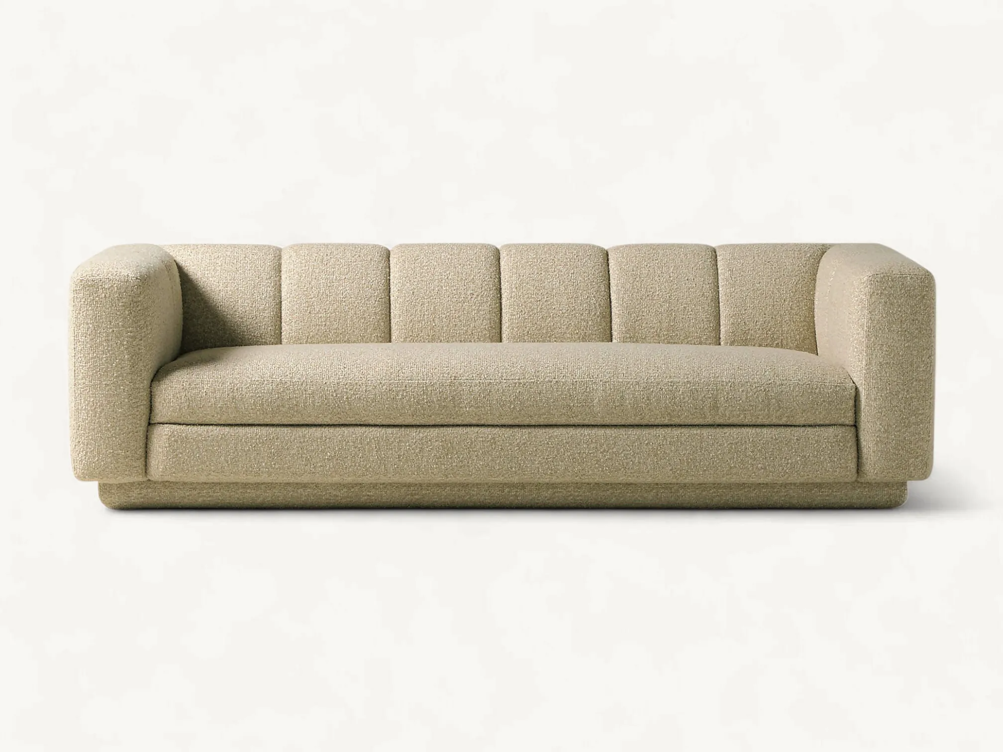 Modern low-profile sofa with vertical channel tufting and textured beige bouclé upholstery.